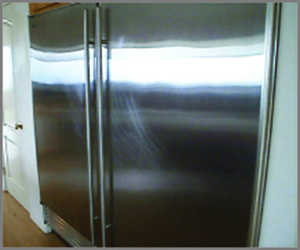 Vancouver stainless steel appliances scratch repair. This is the before image for a stainless steel refrigerator repair.